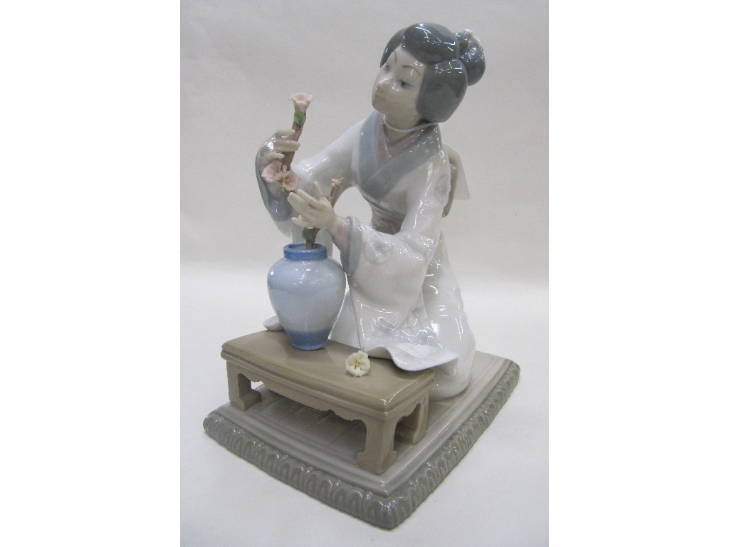 Appraisal: Lladro figure of a Japanese girl decorating -