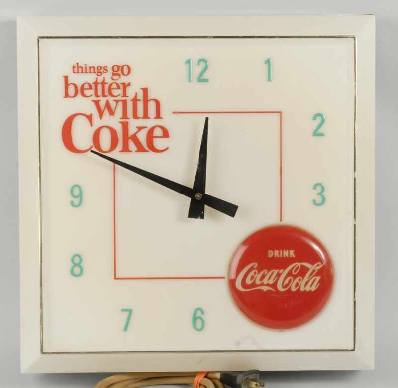 Appraisal: Plastic Metal Coca-Cola Light-Up Clock Description Only very light to