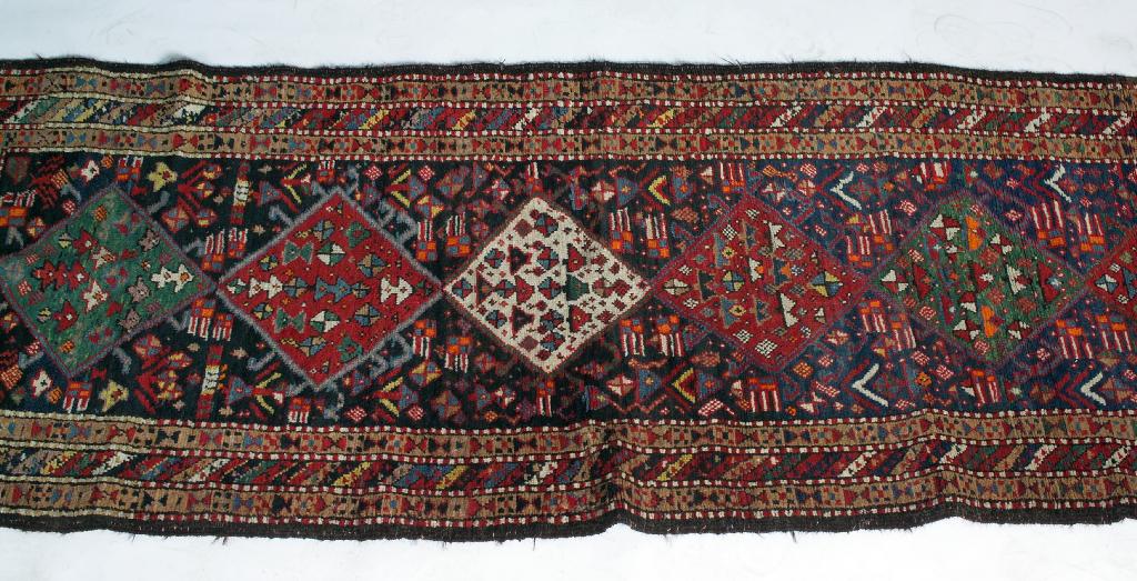 Appraisal: ANTIQUE TURKISH RUNNER the central field with a blue ground