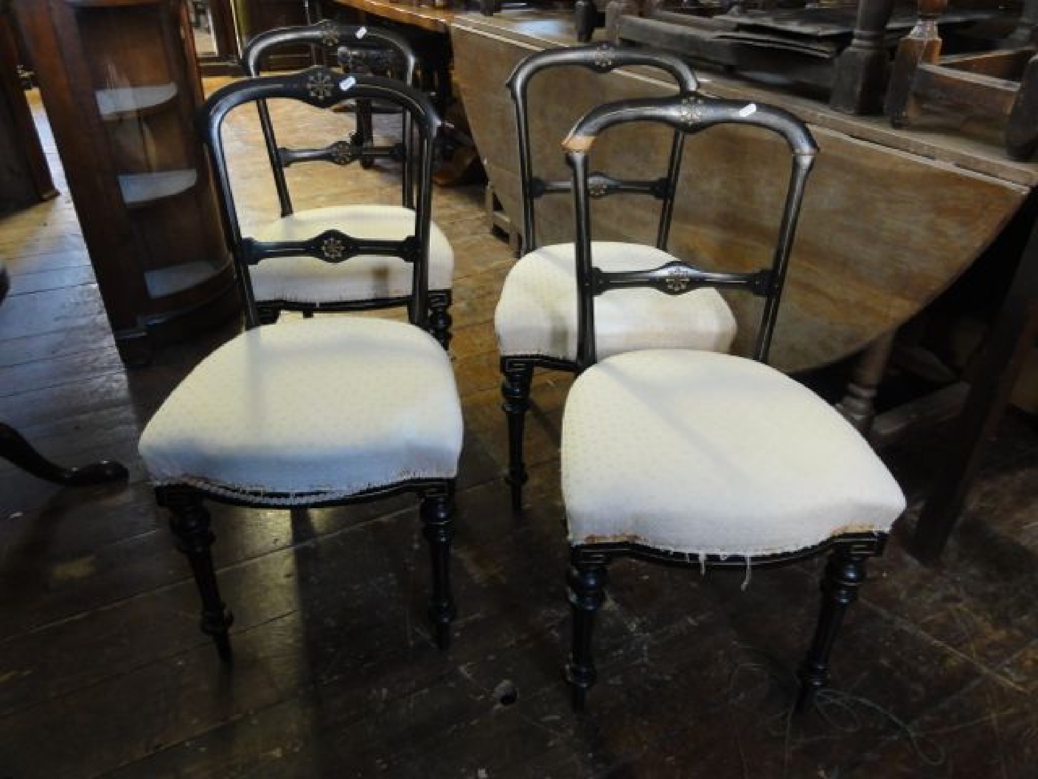 Appraisal: A set of four Victorian ebonised dining chairs with gilt