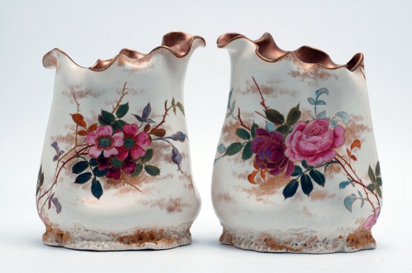 Appraisal: Pair of ceramic vases with handpainted floral decoration on buff