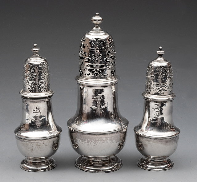 Appraisal: A MATCHING PAIR OF GEORGE II SILVER PEPPERS of baluster