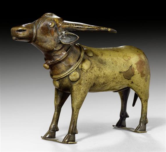 Appraisal: A BRONZE FIGURE OF A STANDING BUFFALO South India Toda