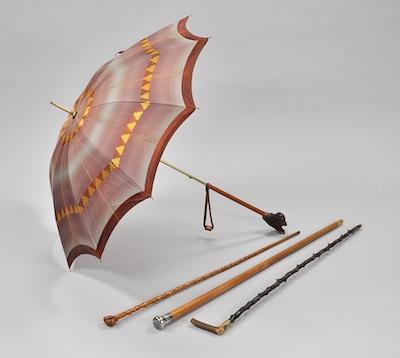 Appraisal: Three Walking Sticks and a Parasol The lot including a