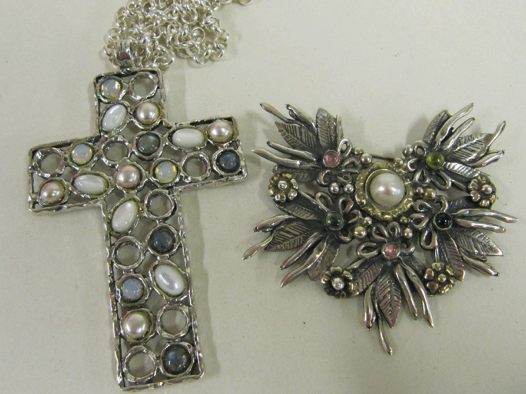 Appraisal: Large silver cross pendant with gem insets and a similar