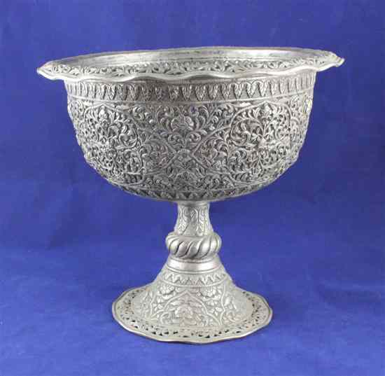 Appraisal: An Indian pierced white metal pedestal vase with floral scroll