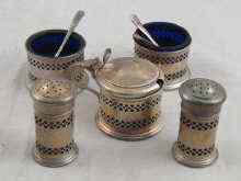 Appraisal: A silver set of two pepperettes two salt cellars and