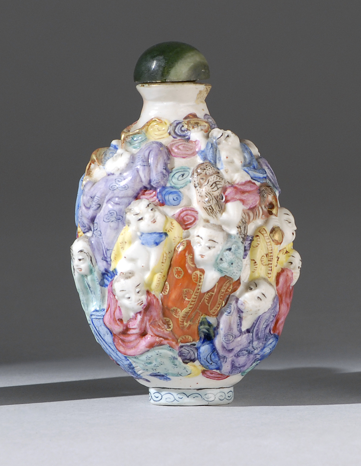 Appraisal: MOLDED PORCELAIN SNUFF BOTTLE In ovoid form with decoration of