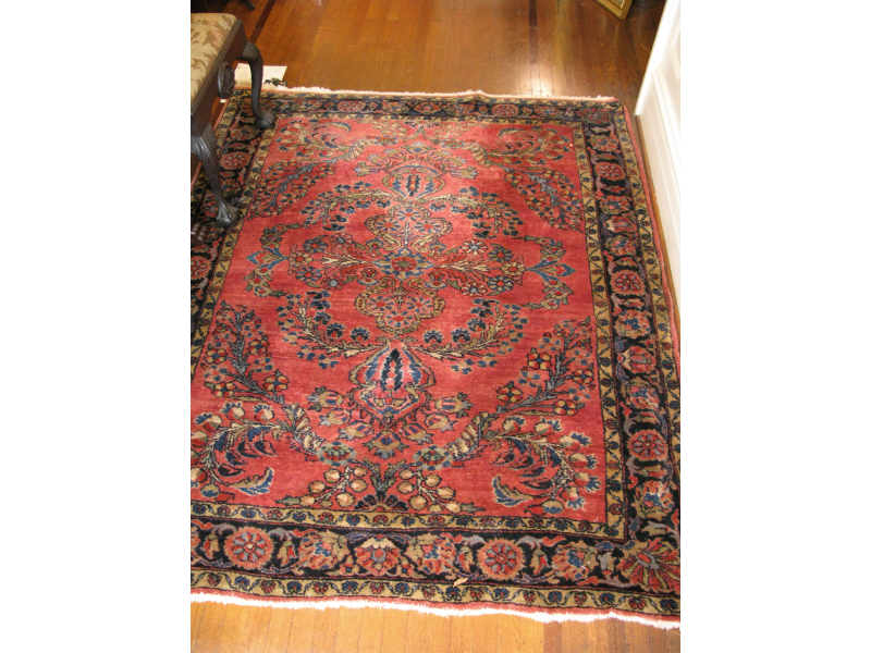 Appraisal: Oriental Area Rug Sarouk ca muted red field with center