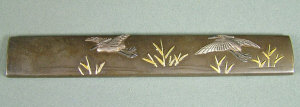 Appraisal: A Japanese bronze Kozuka decorated with flying cranes signed length