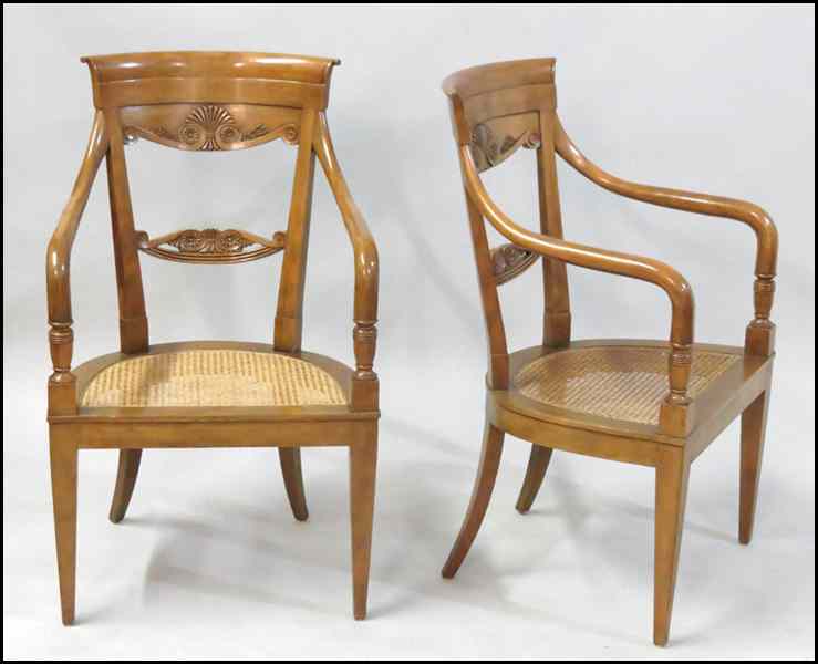 Appraisal: PAIR OF CARVED MAHOGANY OPEN ARMCHAIRS Caned seats Back height