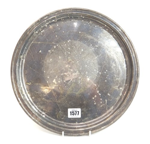 Appraisal: A Sterling silver circular tray decorated with a beaded border