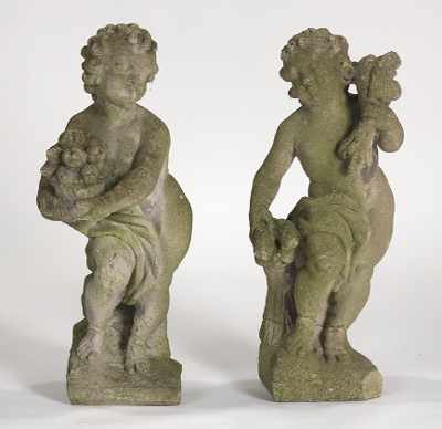 Appraisal: Two Cement Composition Garden Cherubs Facing Fruit Wheat Cast composition