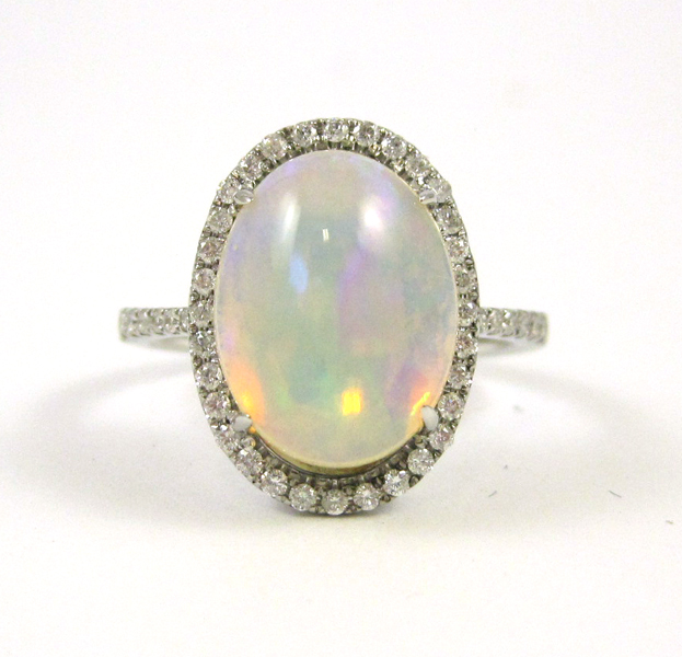 Appraisal: OPAL DIAMOND AND FOURTEEN KARAT WHITE GOLD RING with round-cut