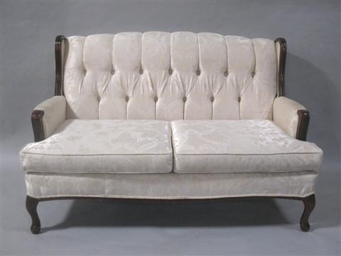 Appraisal: WHITE UPHOLSTERED SETTEE th century button tufted back above upholstered