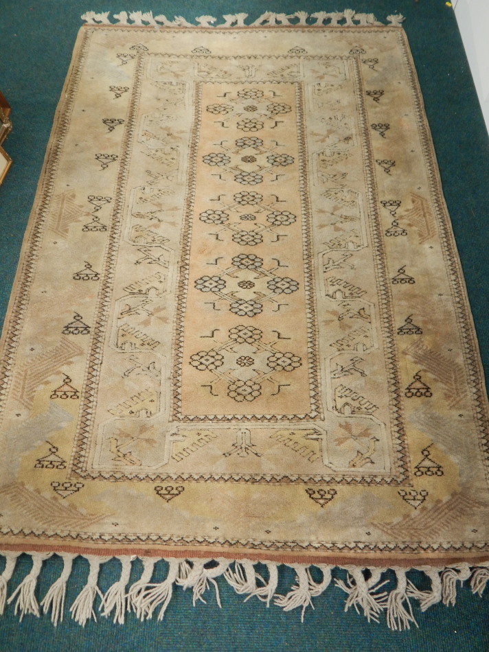 Appraisal: A Turkish rug with a central design of medallions on