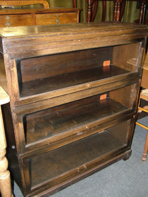 Appraisal: An oak Globe Wernicke three section bookcase upon bracket supports