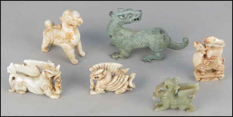 Appraisal: COLLECTION OF CARVED STONE MYTHICAL ANIMALS Together with a patinated