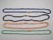 Appraisal: Four bead necklaces including one lapis lazuli necklace with a