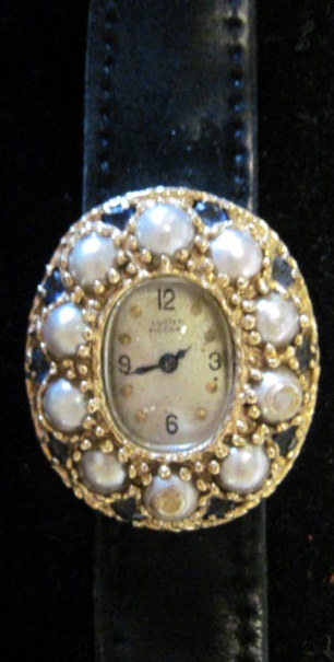 Appraisal: Lady's karat yellow gold pearl and sapphire wristwatch Lucien Piccard