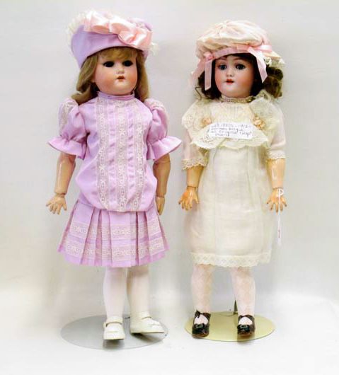 Appraisal: TWO GERMAN BISQUE SOCKET HEAD DOLLS The first marked Heinrich