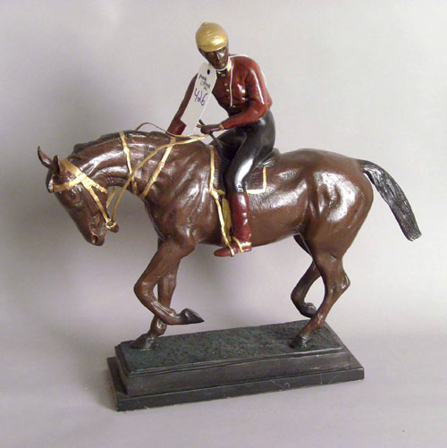 Appraisal: Two painted white metal statues one of a jockey h