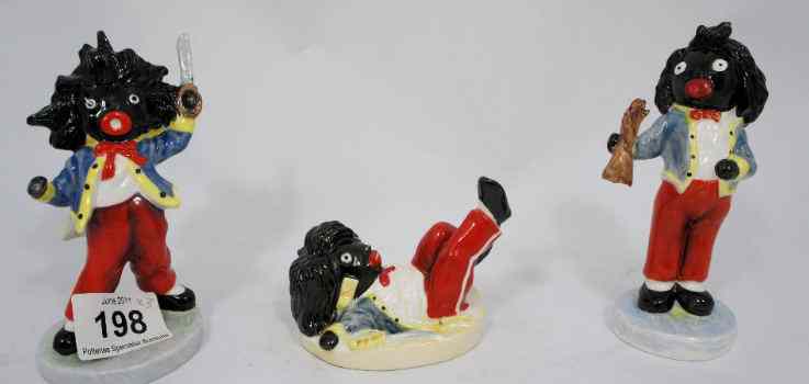 Appraisal: Carltonware Gollywog three small figures depicting a Sword a severed