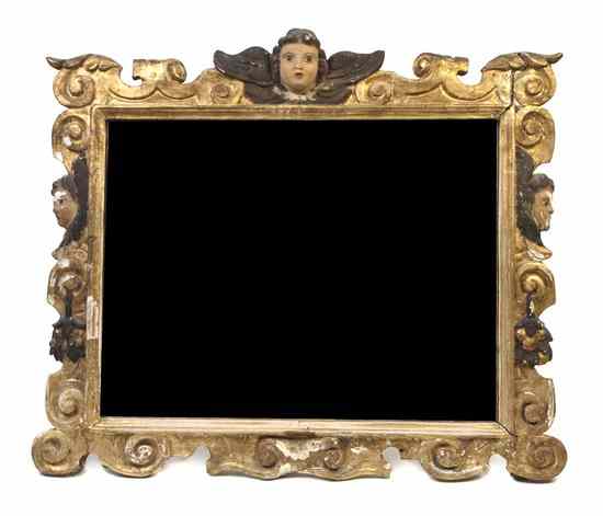 Appraisal: An Italian Painted and Parcel Gilt Mirror the frame carved