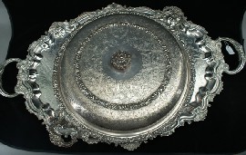 Appraisal: An oval shaped footed silver plated serum tray togehter with