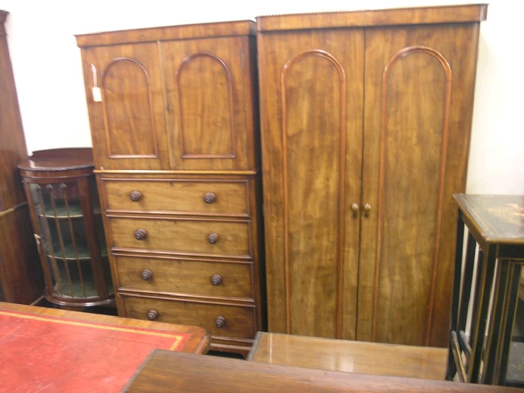 Appraisal: A large Victorian mahogany wardrobe modified featuring a pair of