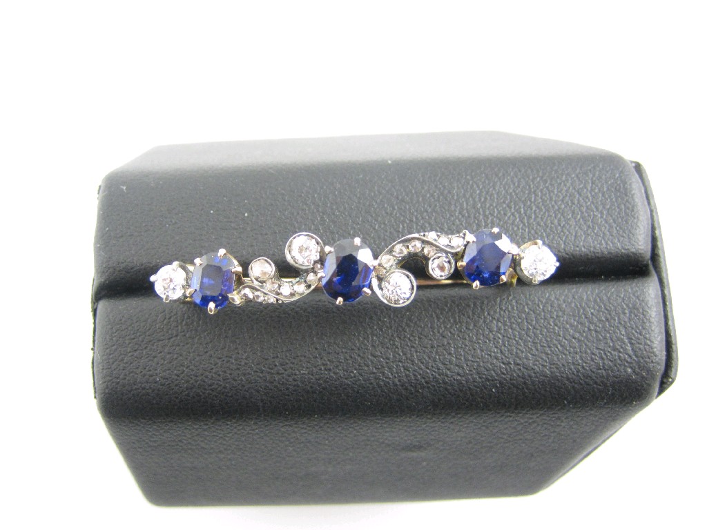 Appraisal: A Victorian Sapphire and Diamond Bar Brooch claw-set three oval-cut