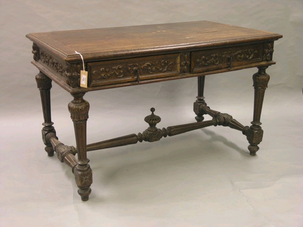 Appraisal: A late Victorian dark oak library table the frieze with