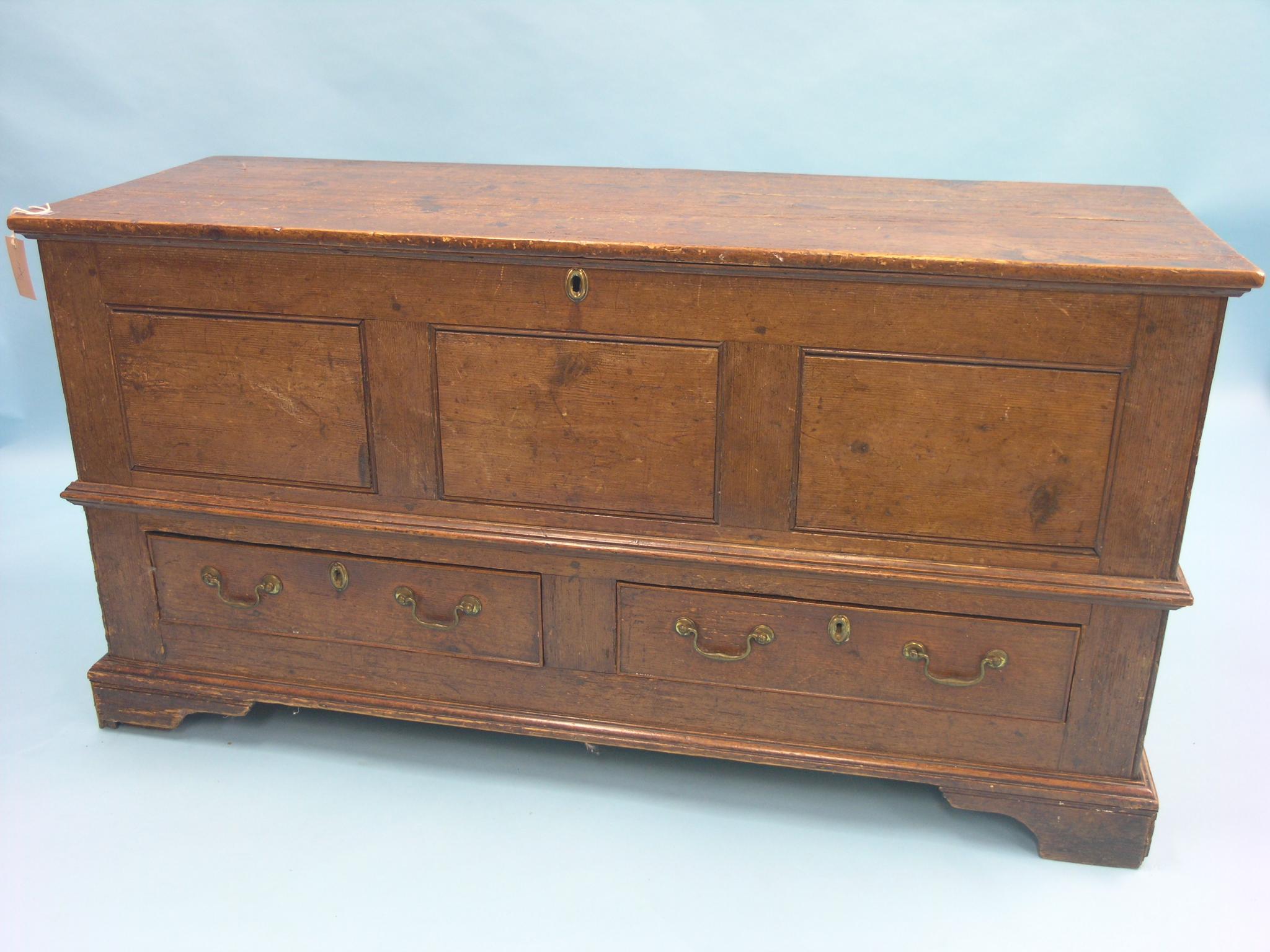 Appraisal: An th century pine bridal chest panelled construction with plank-top