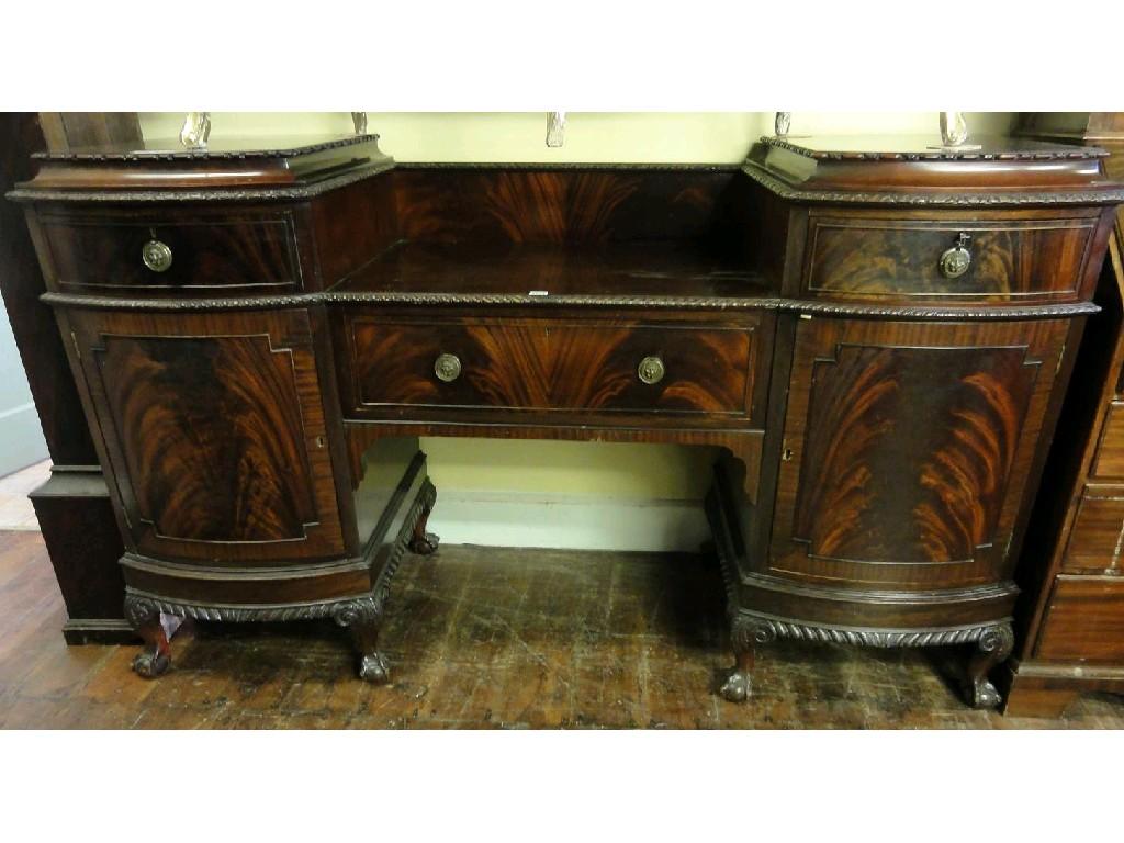 Appraisal: An Edwardian mahogany pedestal sideboard fitted with a central frieze