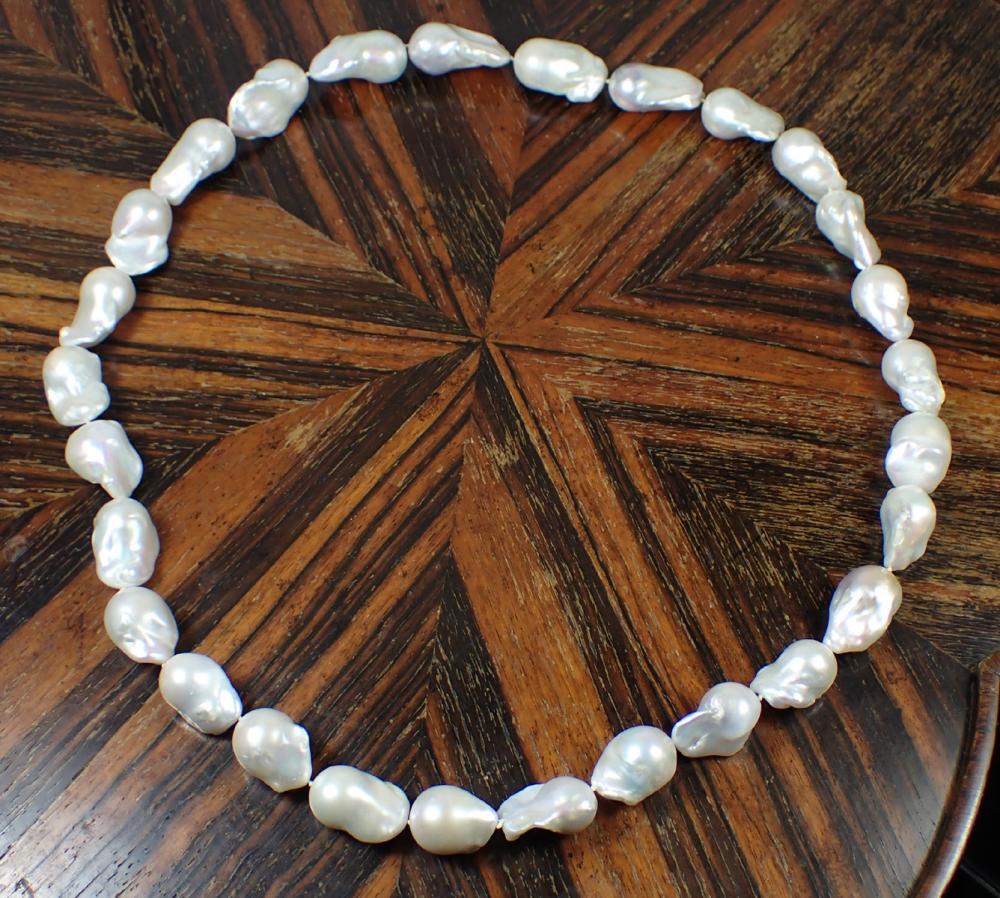 Appraisal: LARGE WHITE BAROQUE PEARL NECKLACE hand-knotted heavy strand made up