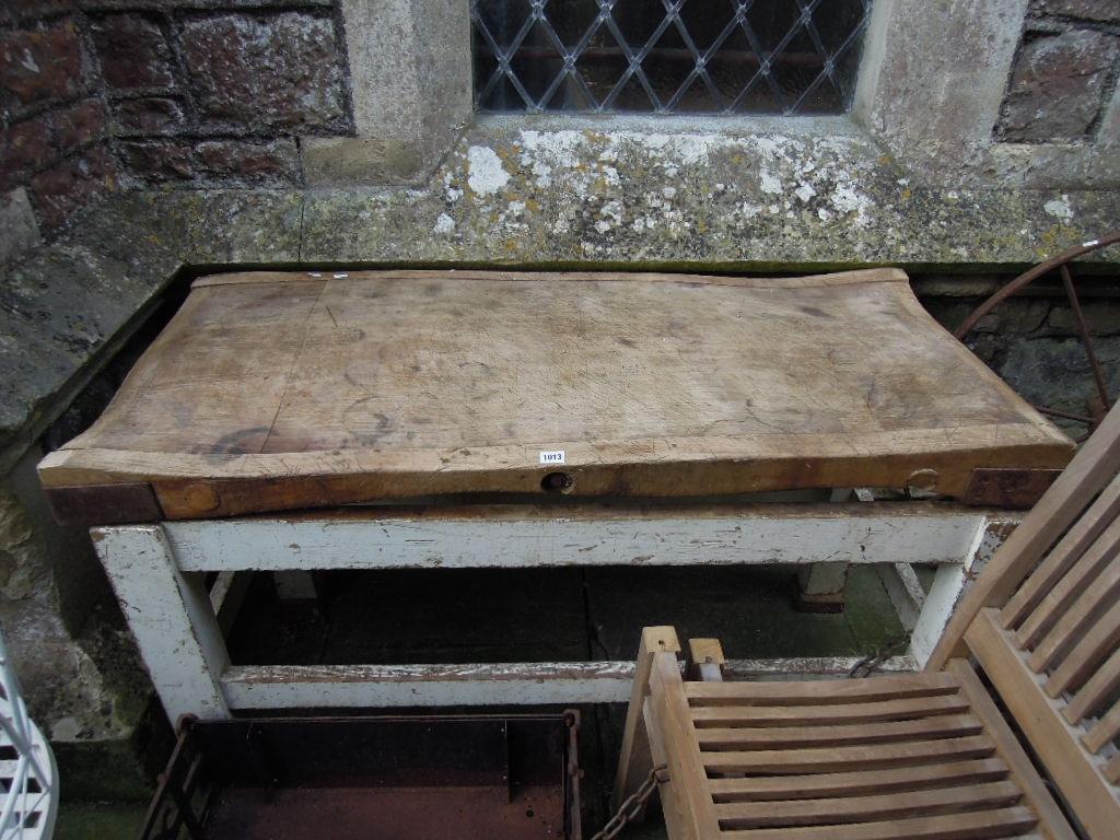 Appraisal: A vintage well used butchers block mounted raised on a