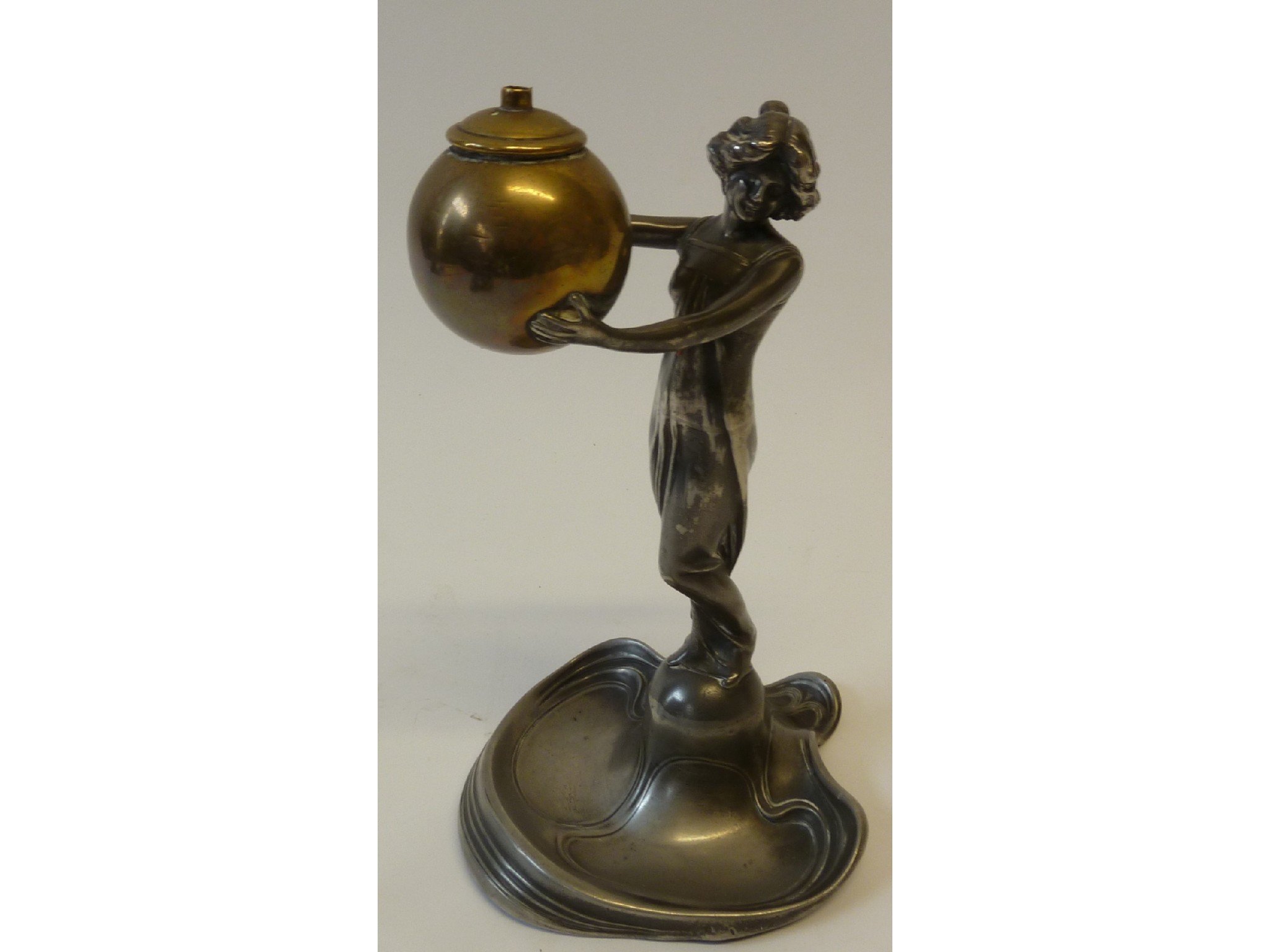 Appraisal: A WMF ART NOUVEAU SILVERED AND BRASS FIGURAL TABLE CIGARETTE