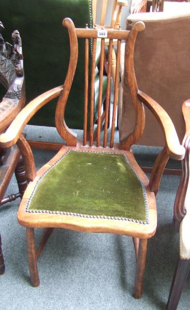 Appraisal: An early th century beech framed open armchair with lyre