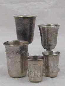 Appraisal: A mixed lot comprising three Russian silver vodka tots together