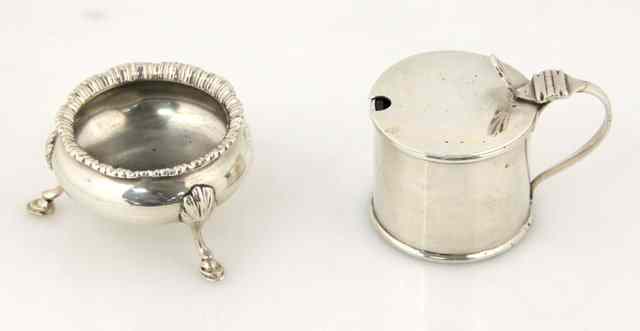 Appraisal: A silver cylindrical mustard pot Birmingham with hinged cover having