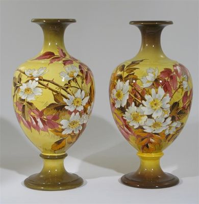 Appraisal: A pair of Doulton Lambeth faience vases baluster form painted