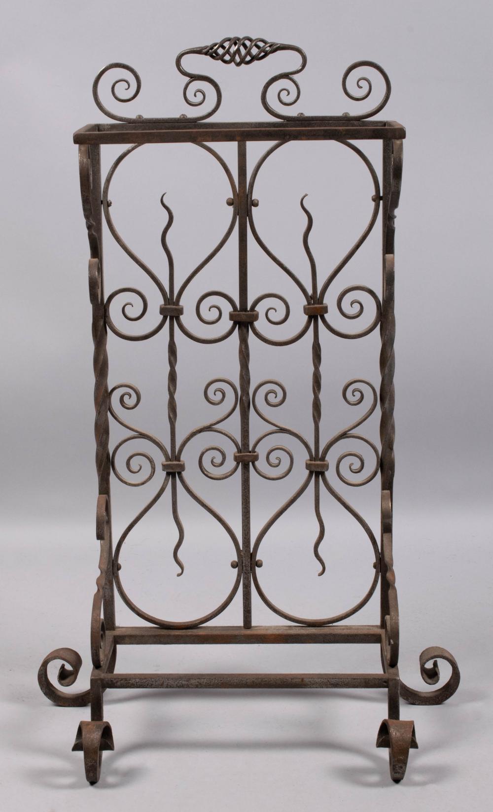 Appraisal: BAROQUE STYLE WROUGHT IRON UMBRELLA STAND the arched scrolling rectangular