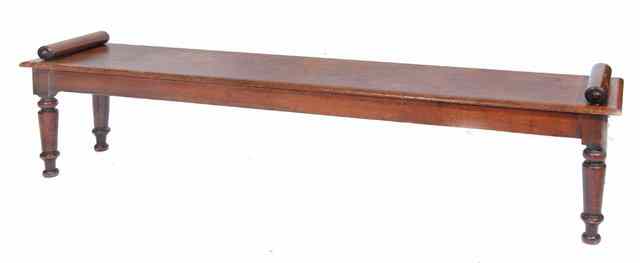 Appraisal: A TH CENTURY MAHOGANY WINDOW SEAT with cylindrical arms and