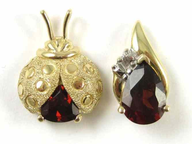 Appraisal: TWO GARNET AND FOURTEEN KARAT GOLD PENDANTS one set with