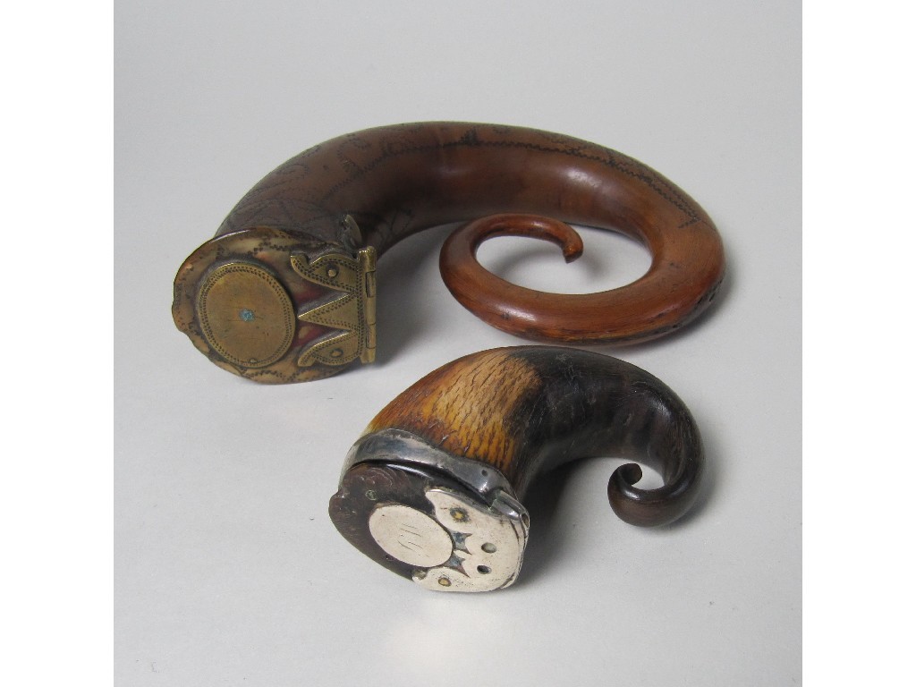 Appraisal: An th century rams horn snuff mull with brass hinge