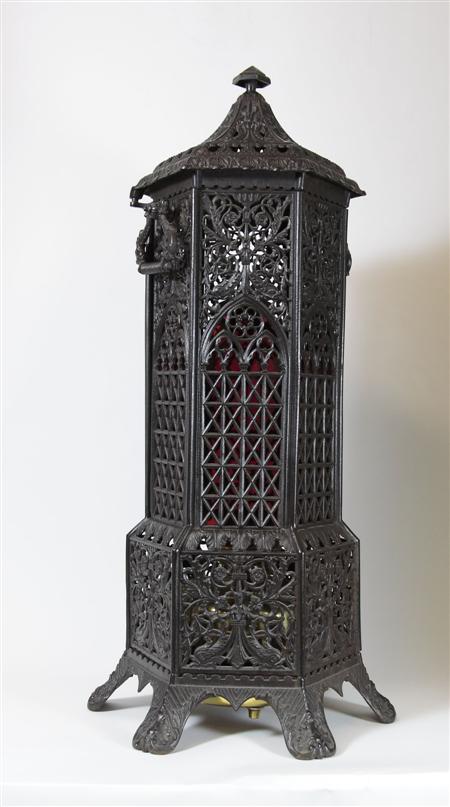 Appraisal: A Victorian ornate cast iron heater of pagoda shape standing