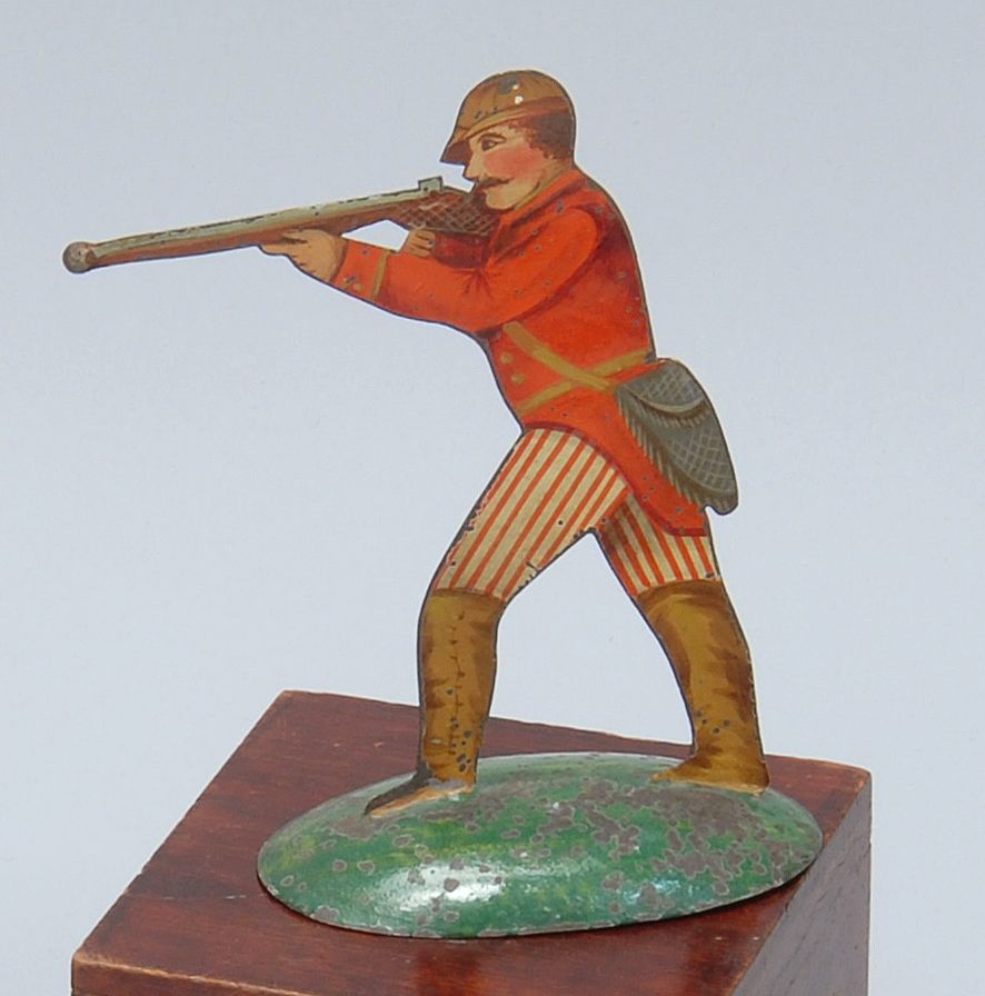 Appraisal: HAND-PAINTED TIN GAME PIECE In the form of a hunter