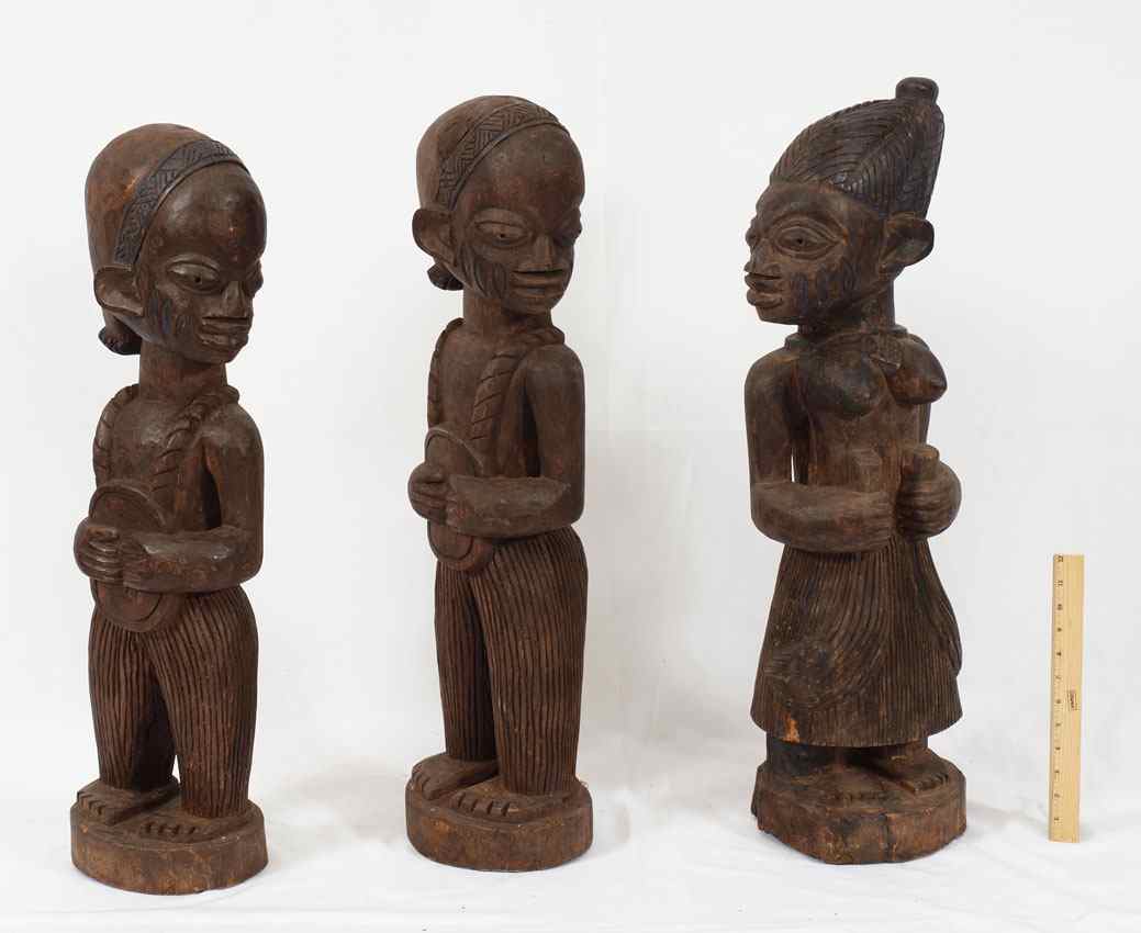 Appraisal: CARVED YORUBA FIGURINES '' x '' x '' lbs ''