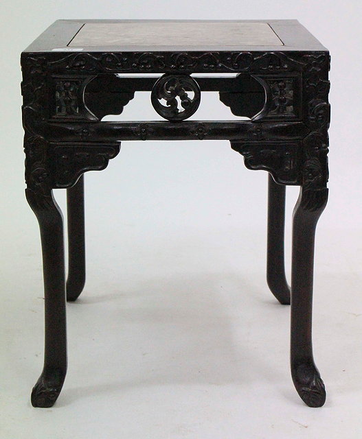 Appraisal: A CHINESE HARDWOOD CARVED MARBLE TOPPED OCCASIONAL TABLE