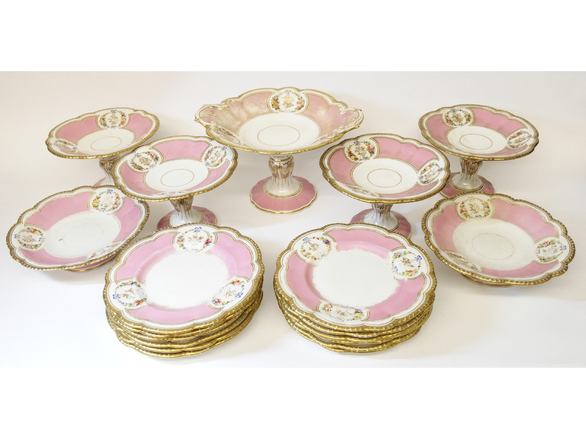 Appraisal: An English porcelain dessert servicewith painted flowers encircling ribbon-tied gilt